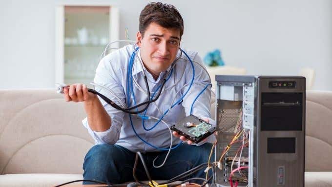 Person disassembling a computer.